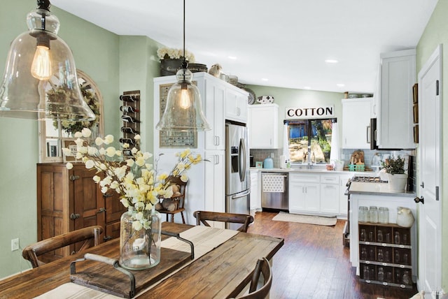 dining space with recessed lighting and dark wood-style flooring