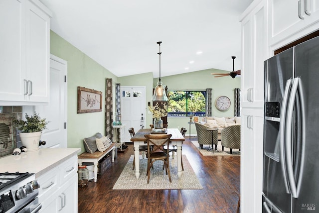 dining area with lofted ceiling, recessed lighting, dark wood-style floors, and ceiling fan