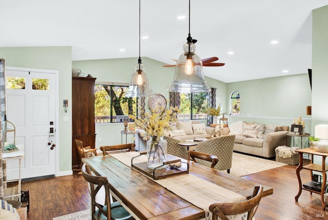 dining area with dark wood-style floors, plenty of natural light, ceiling fan, and vaulted ceiling