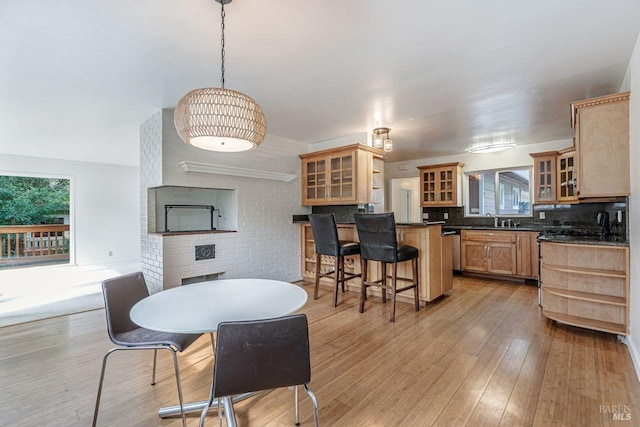 dining area featuring light wood-type flooring