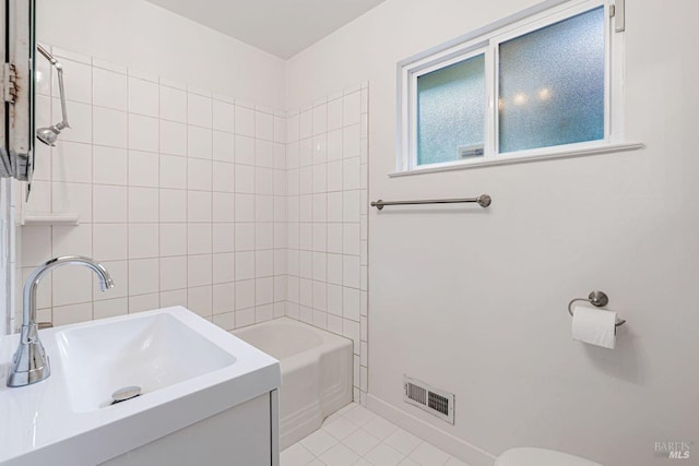 full bathroom featuring tile patterned floors,  shower combination, visible vents, and a sink