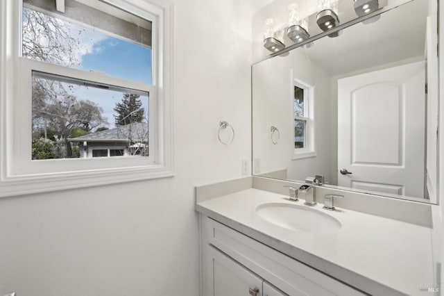 bathroom with vanity and a wealth of natural light