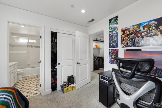 office area featuring recessed lighting, visible vents, light colored carpet, and washing machine and clothes dryer