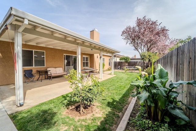 view of yard with a patio and a fenced backyard