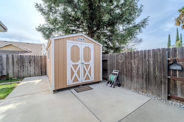 view of shed featuring a fenced backyard