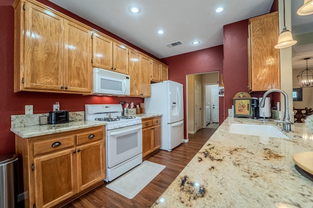 kitchen with white appliances, dark wood-style floors, visible vents, recessed lighting, and a sink