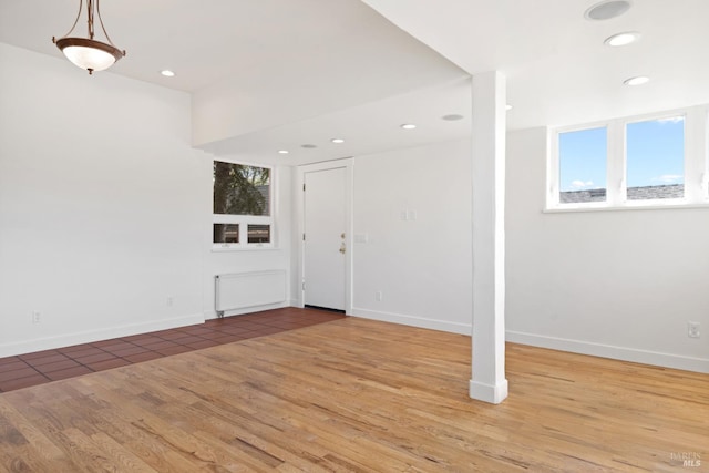 entryway with recessed lighting, wood finished floors, and baseboards