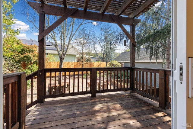 deck featuring a pergola and fence