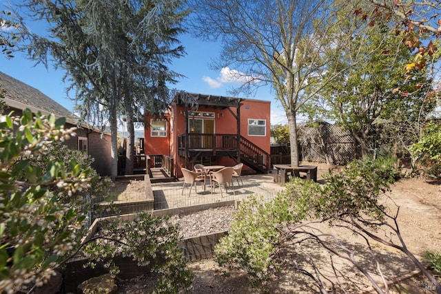 back of house featuring a patio, a pergola, and fence