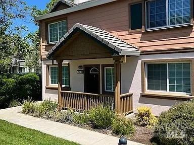 view of exterior entry featuring a porch