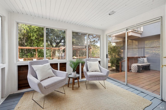 sunroom / solarium featuring wood ceiling