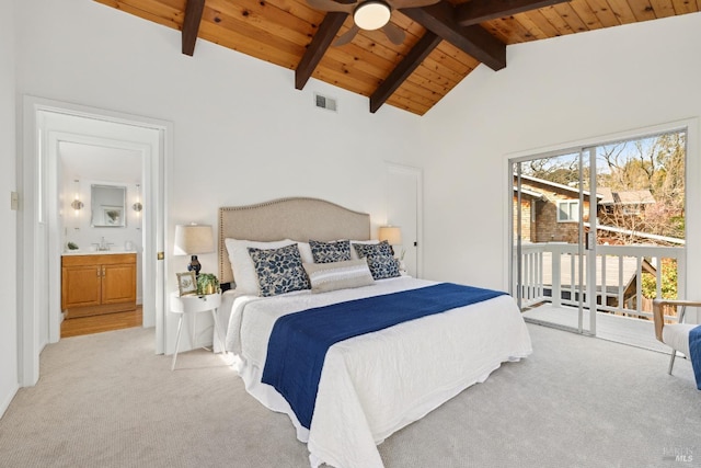 bedroom with visible vents, light colored carpet, beam ceiling, wooden ceiling, and a sink