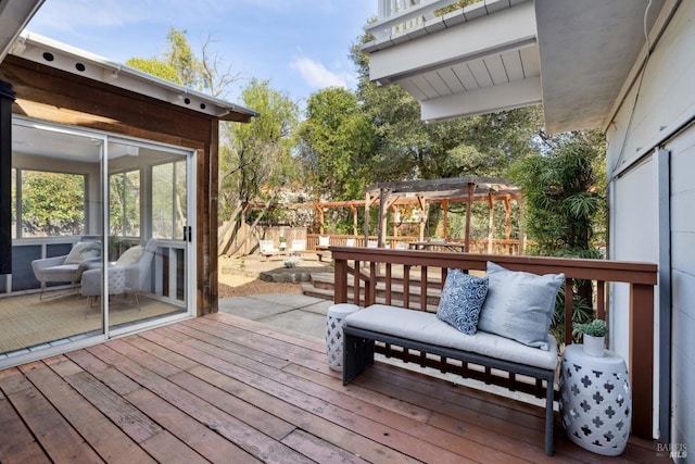 wooden deck with outdoor lounge area and fence