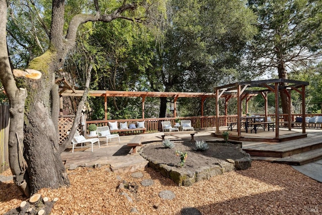 view of home's community with a pergola and a wooden deck