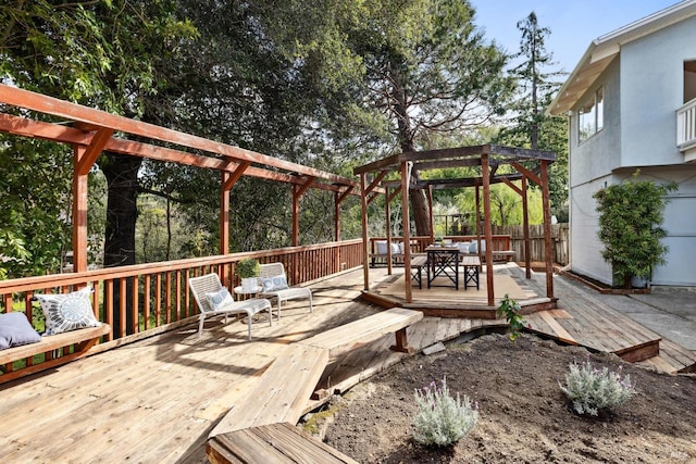 wooden deck featuring outdoor dining space, a pergola, and fence