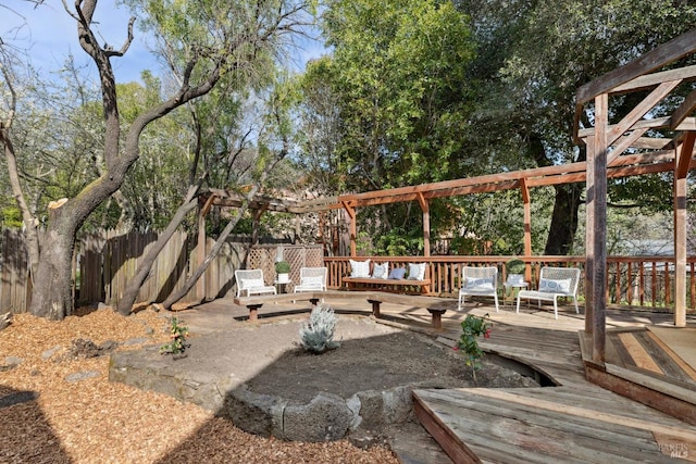 view of yard with fence, a pergola, and a wooden deck