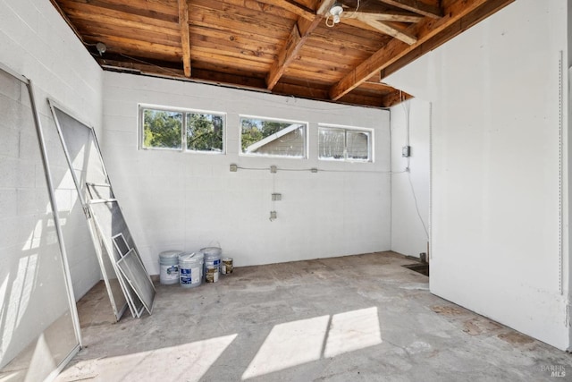 interior space with concrete flooring and concrete block wall