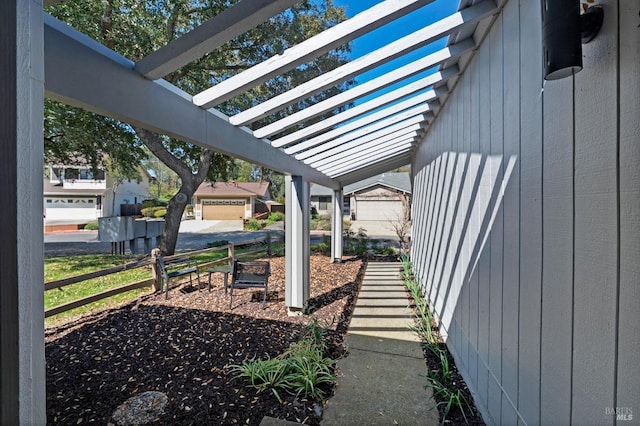 view of yard with fence and a pergola