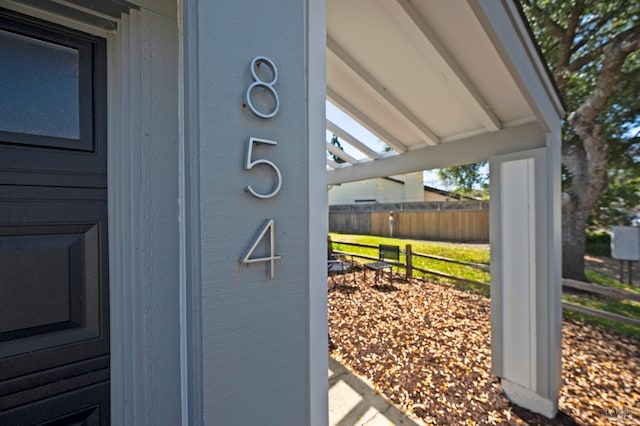 exterior details featuring fence