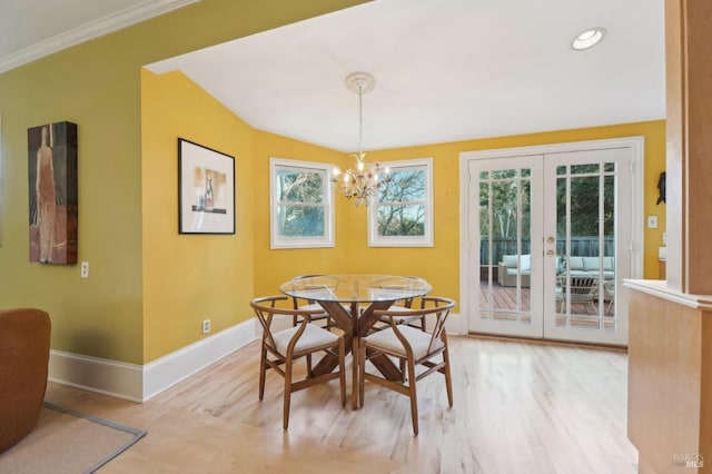 dining room featuring french doors, recessed lighting, light wood-style flooring, baseboards, and a chandelier