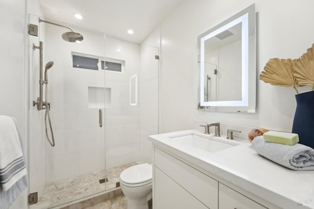 full bathroom with toilet, vanity, recessed lighting, and a stall shower