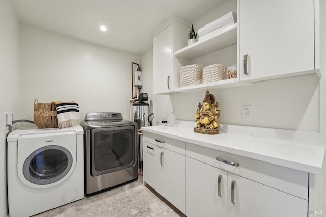 laundry room featuring cabinet space, washing machine and clothes dryer, and recessed lighting
