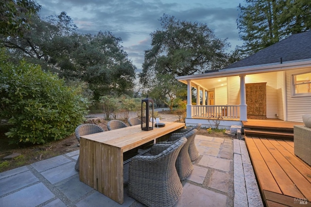 view of patio / terrace featuring a deck and outdoor dining space