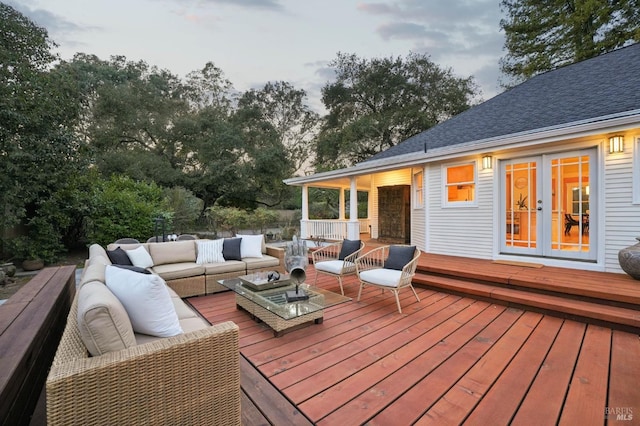 wooden deck with french doors and outdoor lounge area