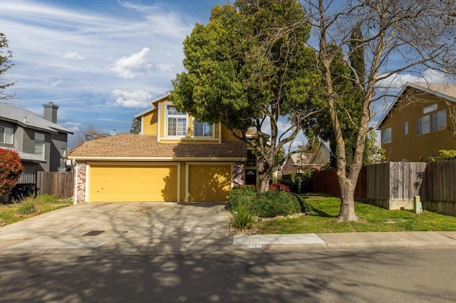 view of front of property with driveway and fence