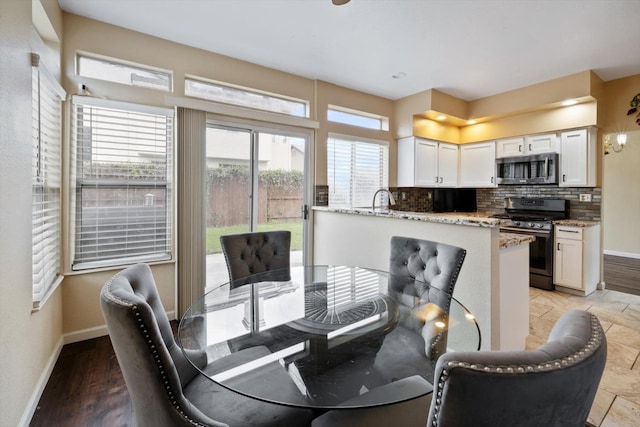 dining area featuring baseboards