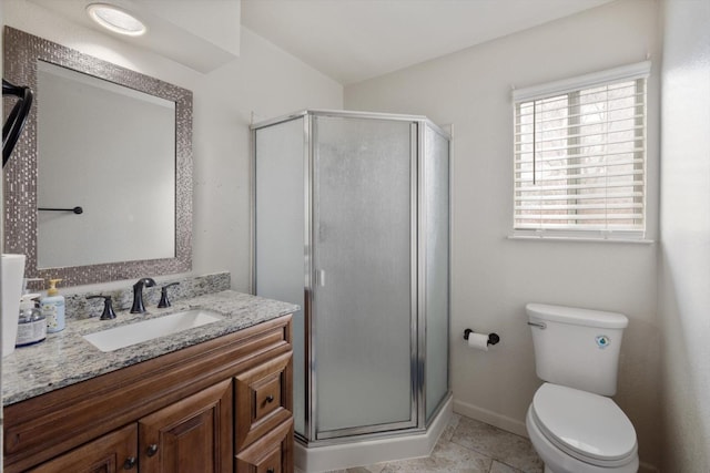 full bath featuring baseboards, toilet, a stall shower, tile patterned floors, and vanity