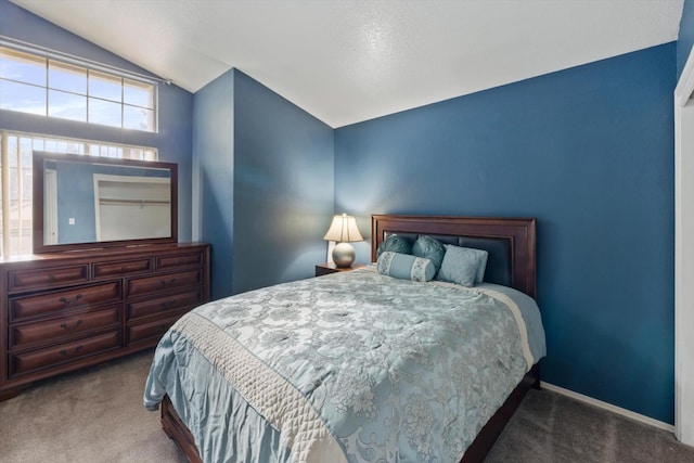 bedroom featuring lofted ceiling, carpet flooring, and baseboards