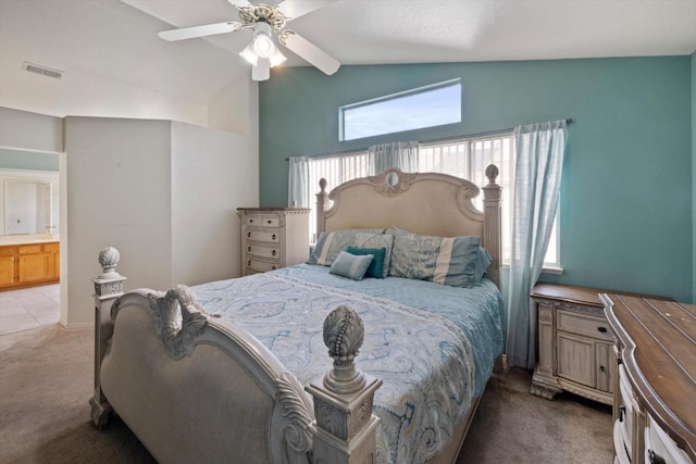 bedroom featuring visible vents, light colored carpet, ceiling fan, and vaulted ceiling