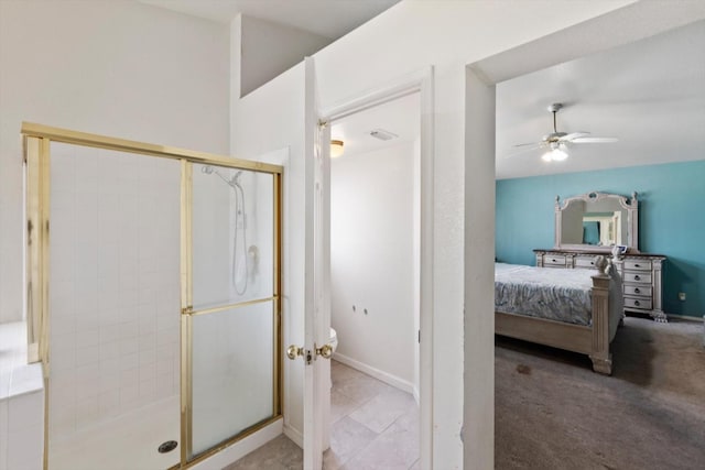 bathroom featuring ceiling fan, baseboards, a stall shower, and connected bathroom