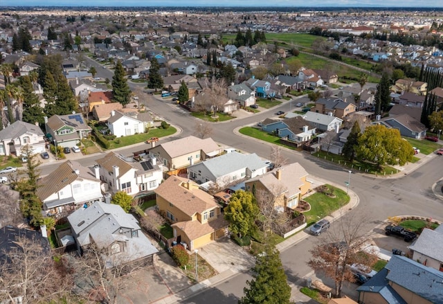 birds eye view of property with a residential view