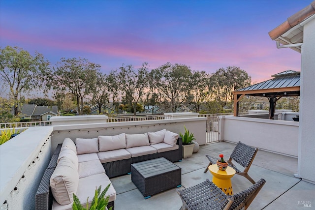 124 Johnson St, Windsor, CA 95492 - patio terrace at dusk featuring outdoor lounge area, a gazebo, and a gate