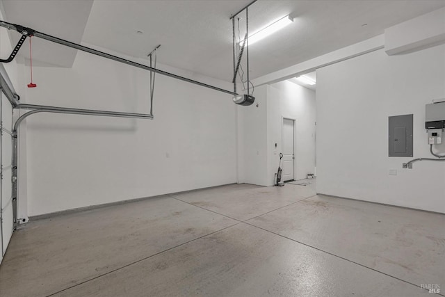 garage featuring a garage door opener and electric panel
