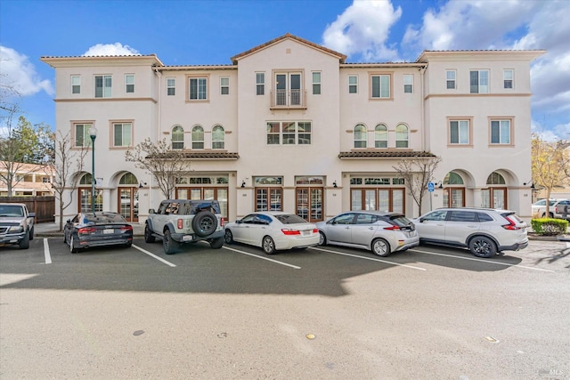 view of building exterior featuring uncovered parking