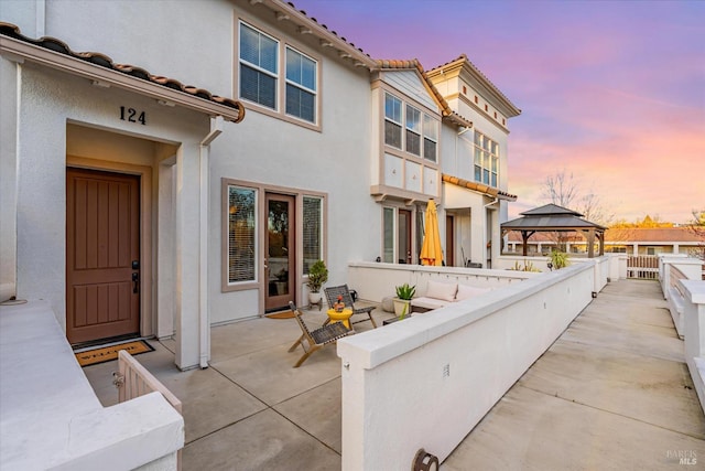 124 Johnson St, Windsor, CA 95492 - patio terrace at dusk with a gazebo, an outdoor living space, and a patio area