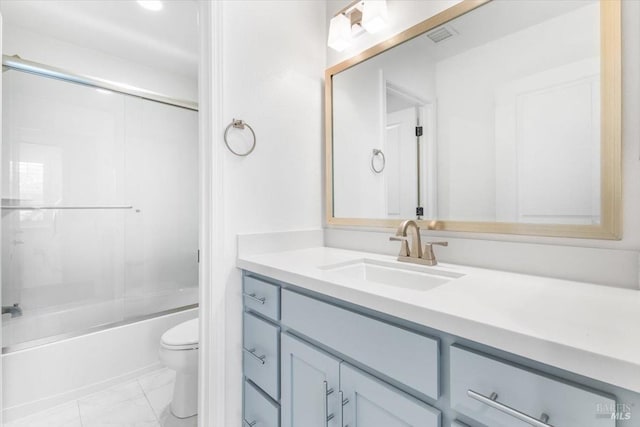 bathroom with visible vents, toilet, marble finish floor, enclosed tub / shower combo, and vanity