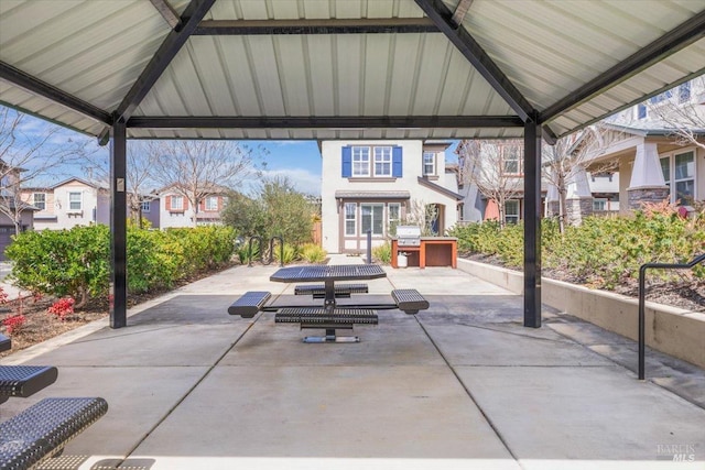 view of patio featuring a gazebo and a residential view