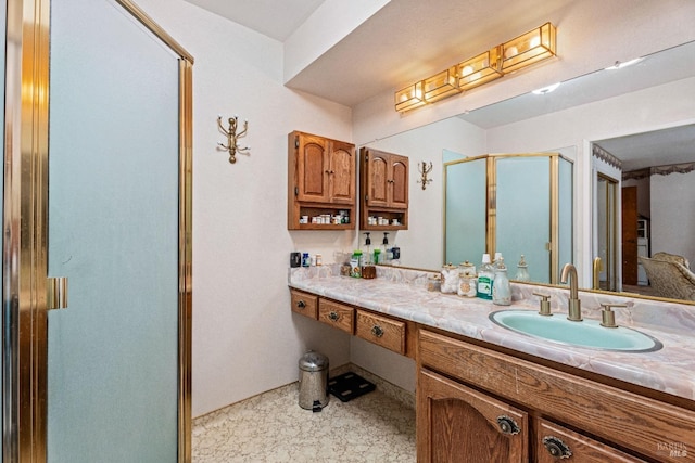 bathroom featuring a stall shower and vanity