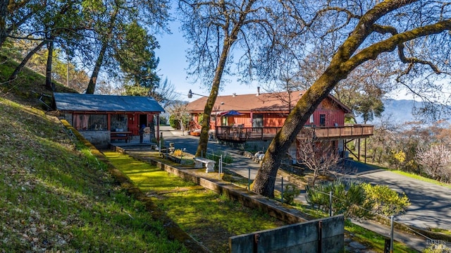 view of yard with a wooden deck