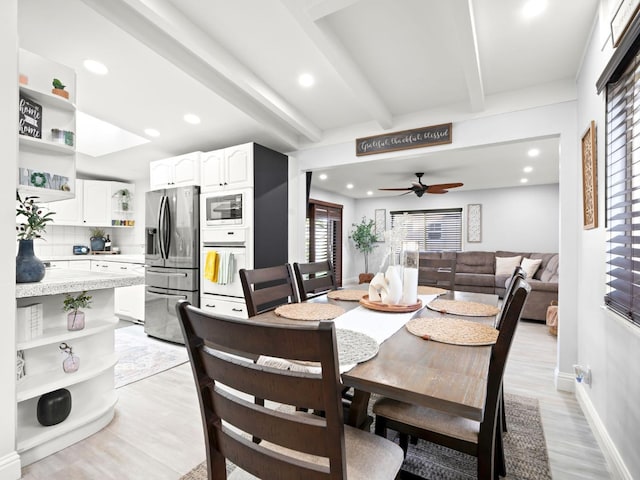 dining space with a ceiling fan, baseboards, light wood finished floors, beam ceiling, and recessed lighting