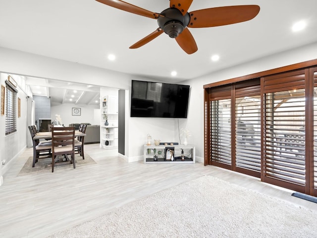 living room featuring a ceiling fan, recessed lighting, wood finished floors, and baseboards