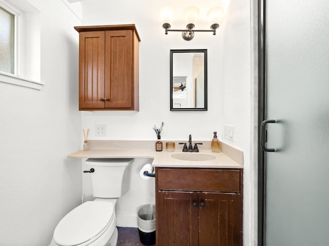 bathroom with toilet and vanity