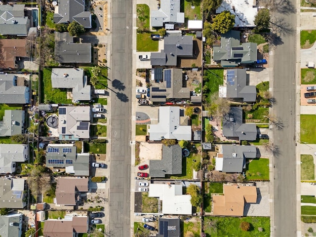 birds eye view of property with a residential view