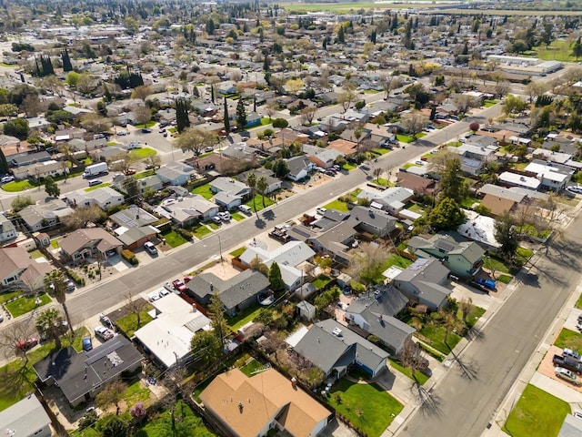 birds eye view of property with a residential view