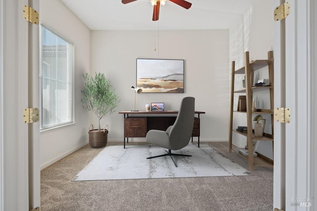 office area with ceiling fan, baseboards, carpet, and plenty of natural light