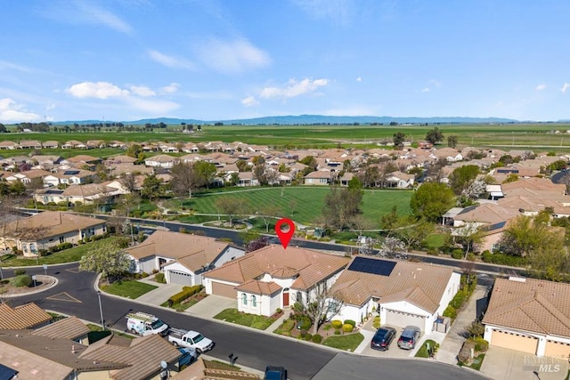 drone / aerial view with a mountain view and a residential view
